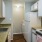 a kitchen with white cabinets