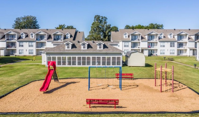 A perfect fit for the whole family a playground behind a building