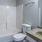 a bathroom with a tub sink and toilet