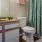 a bathroom with a green shower curtain