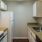 a kitchen with white cabinets