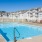 a swimming pool with chairs around it